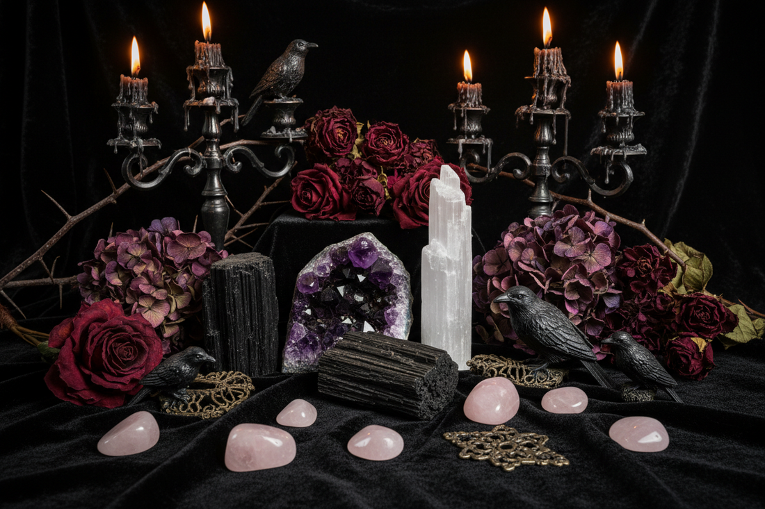 A collection of crystals including amethyst, black tourmaline, selenite, and rose quartz arranged on black velvet with gothic decor.