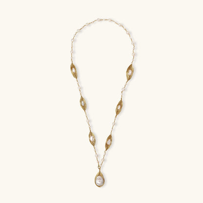 14K gold plated necklace with organic leaf motifs and freshwater pearls arranged in an elegant chain design on neutral background.