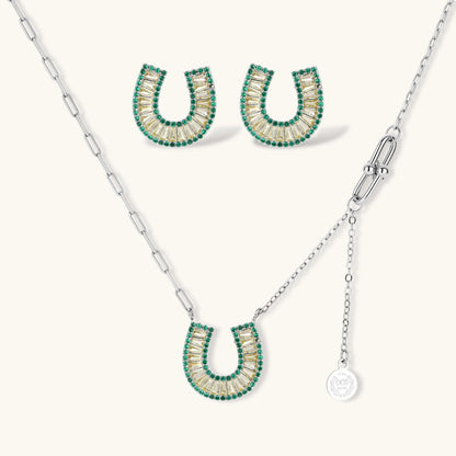 Geometric horseshoe-shaped jewelry set with radiating white zirconia center and jade-green border stones on white background.