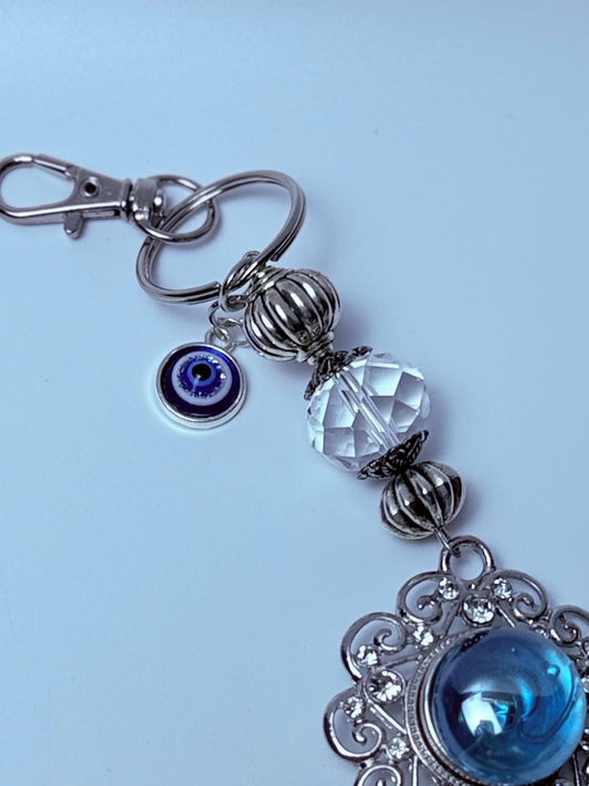 Blue Gemstone Evil Eye Bag Charm: Boho Silver Tassel, Feather & Crystal