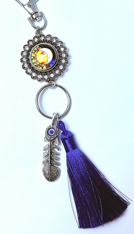 Sun & Evil Eye Feather Bag Charm: Boho Purse Keychain with Purple Tassel